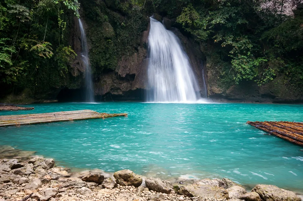 The turquoise tiered pools of Kawasan Falls in Badian, one of the top things to do in south Cebu