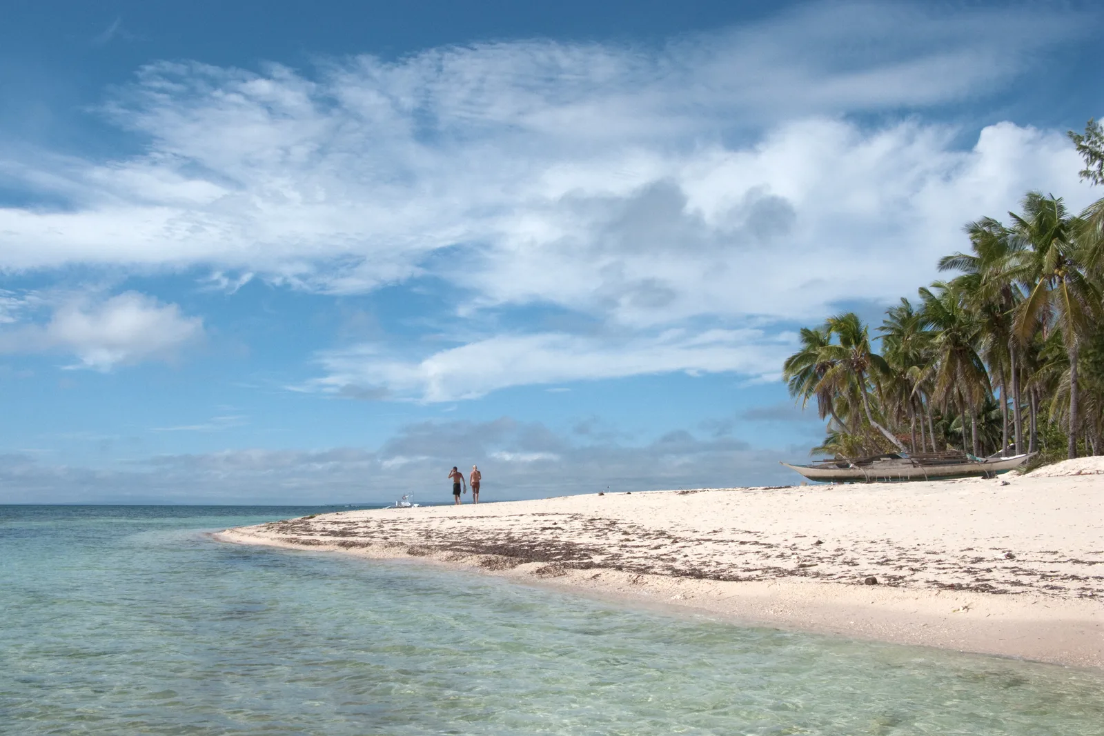 Photo: Vyacheslav Argenberg / CC BY 4.0, via Wikimedia Commons The white sand and moored outrigger boats along Bounty Beach on Malapascua Island, Cebu
