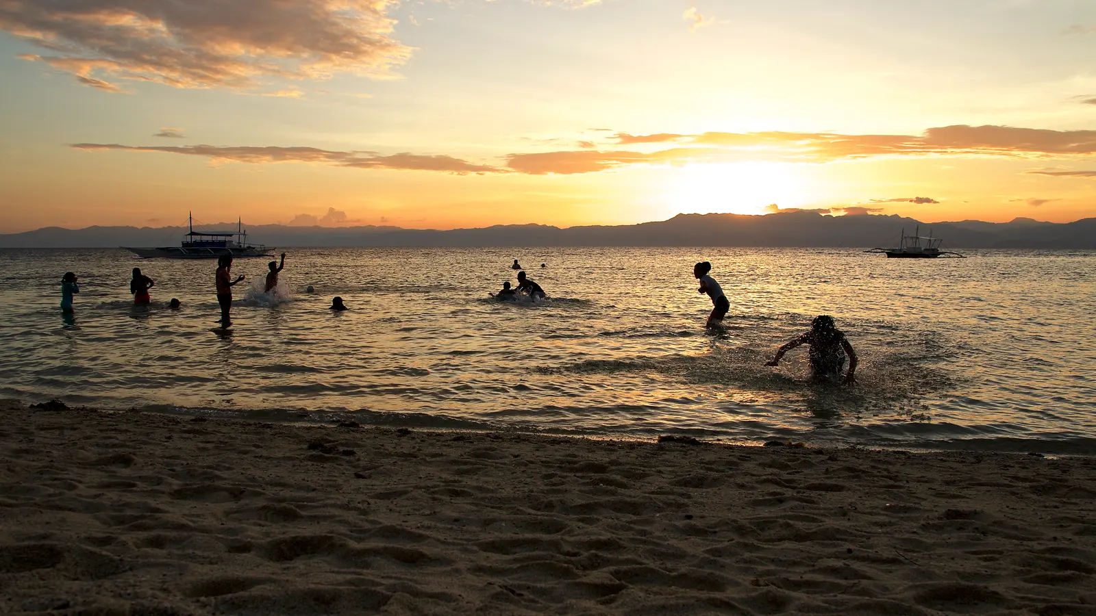 Panagsama Beach in Moalboal at sunset, a popular first base for a Cebu honeymoon itinerary