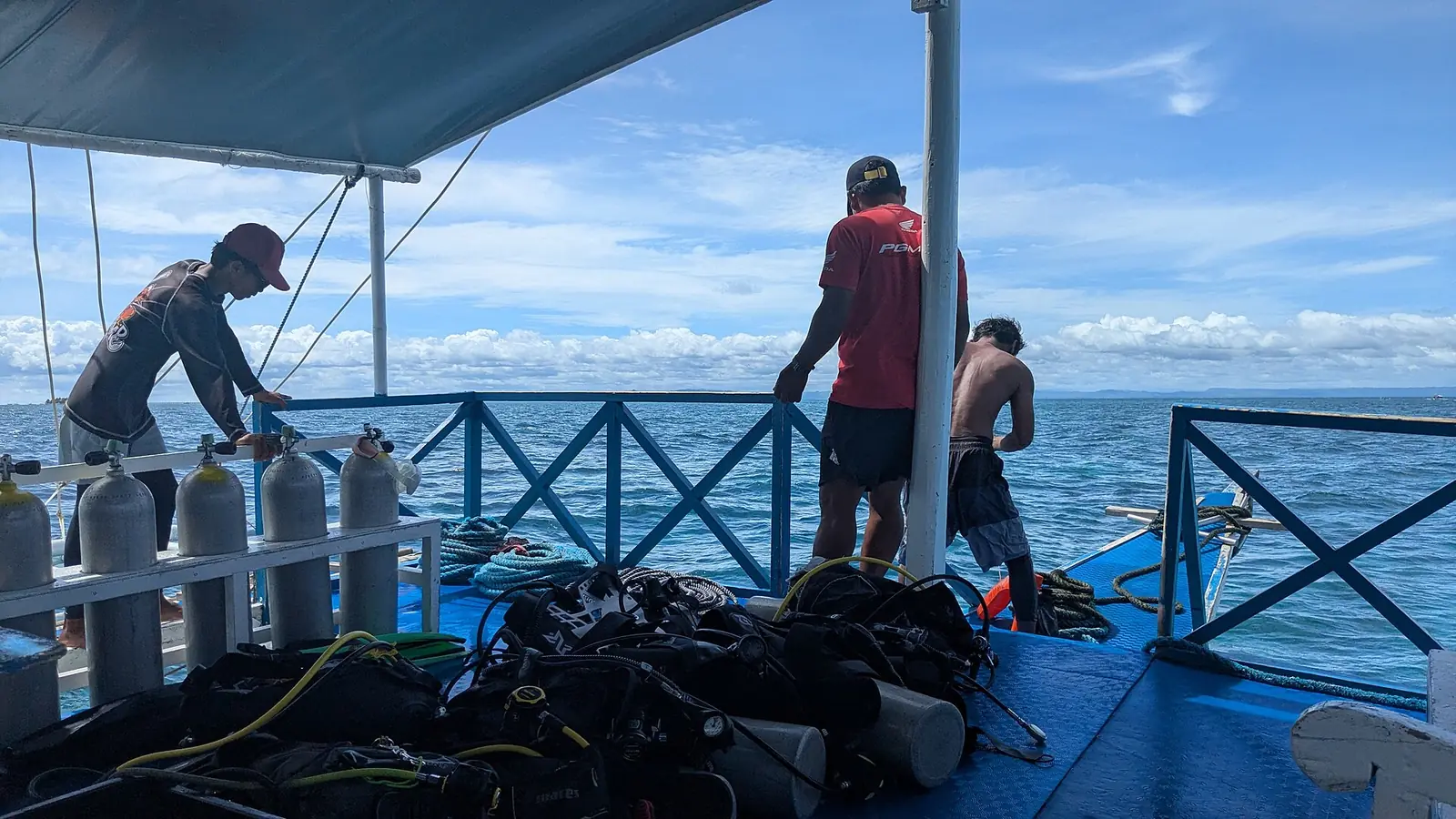 Scuba cylinders lined up on the deck of a dive bangka off Mactan