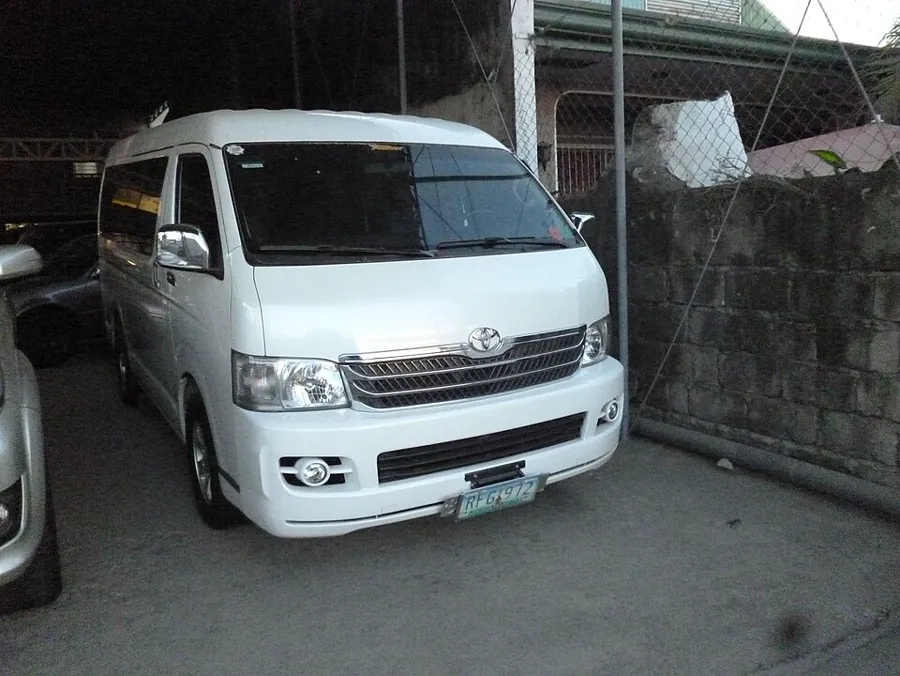 A clean Toyota HiAce Super Grandia van, the kind used for private driver hire in Cebu