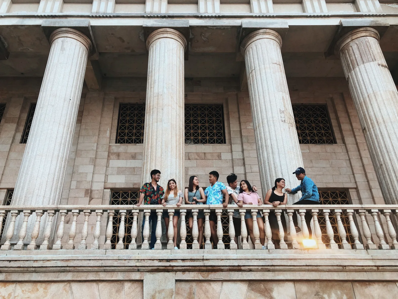 A group of friends smiling and chatting together in Cebu